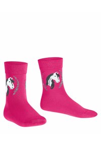 Chaussettes en coton rose avec un design de licorne en noir et blanc, agrémentées de motifs floraux, avec un haut côtelé et un tissu texturé.