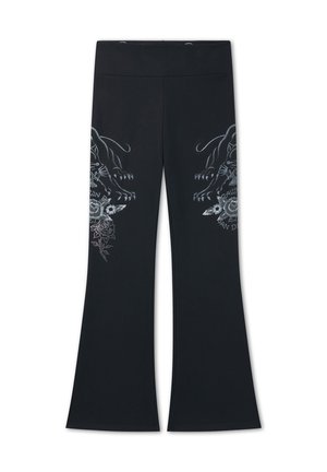 Pantalones acampanados negros con cintura alta y diseños espejados de panteras plateadas y flores en los muslos.