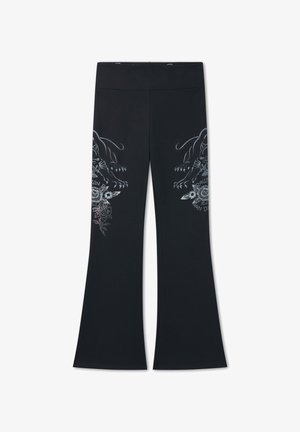 Pantalones acampanados negros con cintura alta y diseños espejados de panteras plateadas y flores en los muslos.