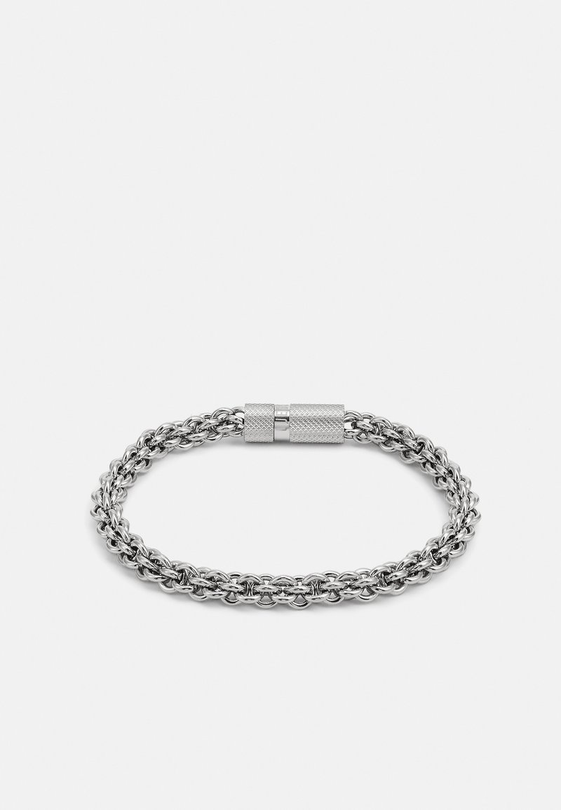 Silver metal bracelet made of interwoven links with a textured clasp. Features a smooth finish and a circular shape.