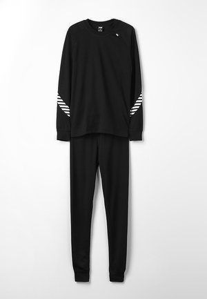 Zwarte langemouwen top met witte gestreepte accenten op de mouwen en bijpassende zwarte broek, gemaakt van zachte stof, met een relaxte pasvorm.