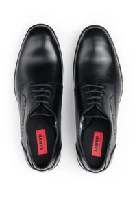 Chaussures habillées noires en cuir avec une finition lisse, un design à bout rond et un système de laçage. Présentent des accents bleus et une doublure imprimée.