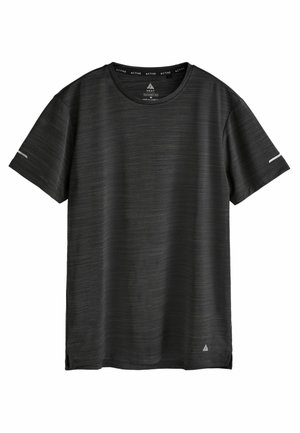T-shirt de sport noir uni à manches courtes avec petit logo blanc près de l’ourlet et fines bandes réfléchissantes sur les manches, col rond.