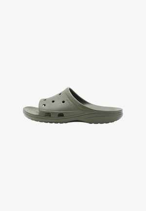 Zoccolo grigio chiaro tipo slip-on con fori di ventilazione, punta arrotondata, suola texturizzata e logo Crocs sul lato.
