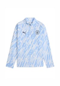 Világoskék, hosszú ujjú pulcsi félcipzárral. Átlós csíkmintázattal és Manchester City logóval a mellkasán.