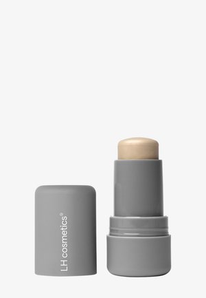 Grey cylindrical makeup stick with cap removed, beige product extended, labeled "LH cosmetics" on the cap.