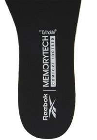 Semelle orthopédique noire avec surface texturée, arborant les inscriptions "Reebok" et "MemoryTech Comfort Footbed" en lettres blanches.