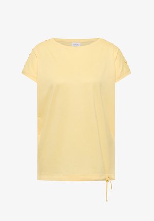 Chemise jaune clair à manches courtes avec encolure ronde, petits plis sur les manches et cordon de serrage ajustable en bas à droite.
