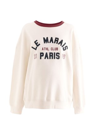 Off-white pusa bordoopunase kraega ning musta ja bordoopunase tekstiga "LE MARAIS ATHL CLUB 1999 PARIS" ees.