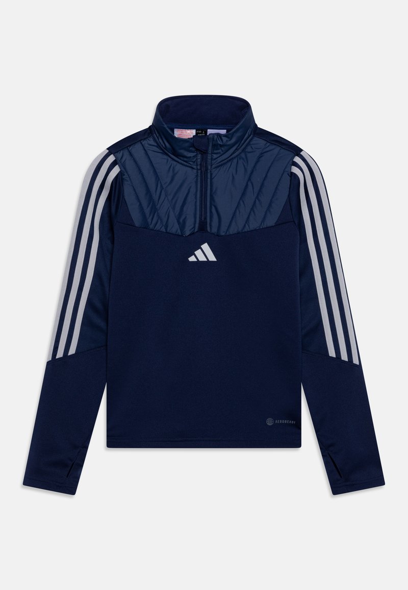 Pull-over à col zippé marine avec un haut texturé, des accents gris à trois rayures sur les manches et un logo réfléchissant. Fabriqué en tissu qui évacue l'humidité.