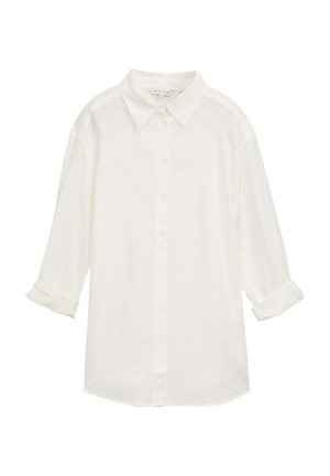 Valge puuvillane nööbiga särk kraega, pikkade varrukatega, mille varrukad on üles keeratud ja tekstuuriga kangast. Omab sirget alumist serva ja nööpide kinnitust.