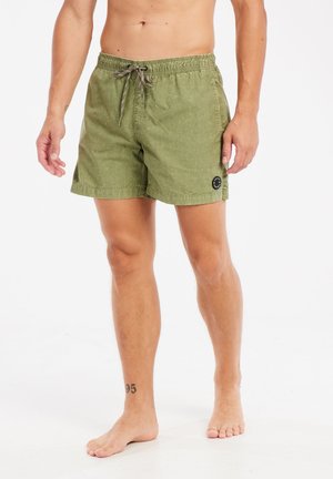 Groene zwemboxers van lichtgewicht stof, met een elastische tailleband met trekkoord en een rond logo op de linkerbeen.
