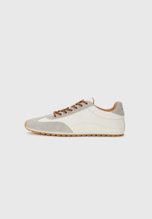 Light gray and cream sneaker with a suede and canvas upper, brown laces, and a textured rubber sole. Features subtle branding on the side.