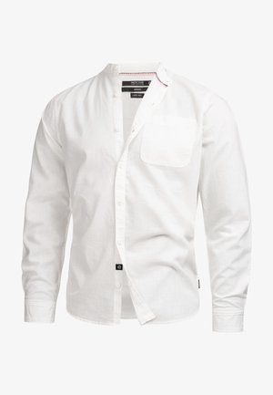 White long-sleeve shirt made from a linen blend, featuring a stand collar, front buttons, a chest pocket, and a brand tag at the hem.