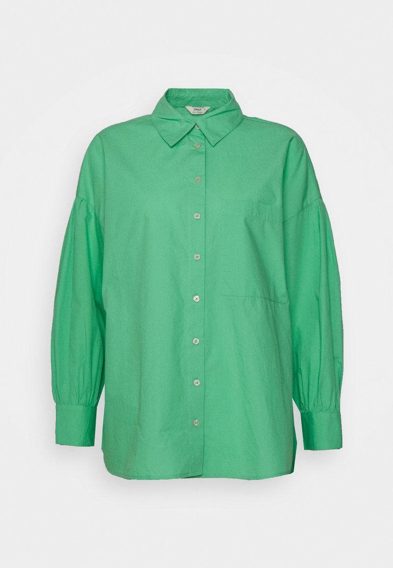 Green oversized button-up shirt made of cotton, featuring a collar, long puff sleeves, and a single chest pocket. Smooth texture.