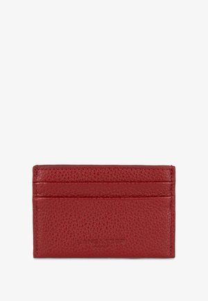 Red leather cardholder featuring a textured surface, five card slots, and embossed brand name, compact rectangular shape.