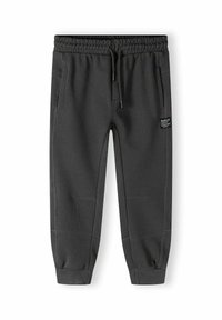 Grijze sweatpants met een elastische tailleband en trekkoord, met zijzakken en geribbelde boorden bij de enkels. Zachte textuur, eenvoudig ontwerp.