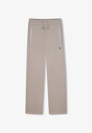 Pantalon beige à jambes droites avec ceinture élastique et cordon, poches latérales zippées avec bordure réfléchissante et petit logo sur la cuisse droite.