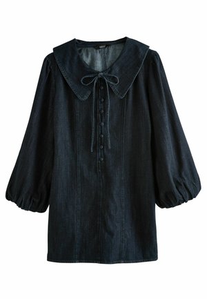 Blusa in denim scuro con un ampio colletto, maniche a sbuffo, un fiocco frontale e dettagli con bottoni lungo il centro. Tessuto morbido.