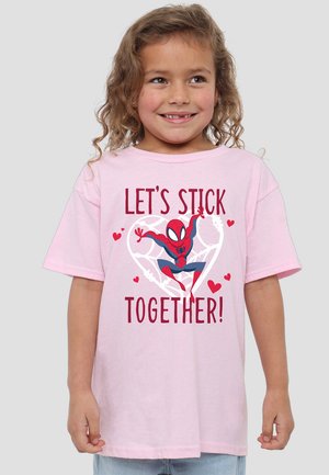 Pink cotton t-shirt featuring a cartoon spider character in a heart design with the text "LET'S STICK TOGETHER!" in bold red letters.