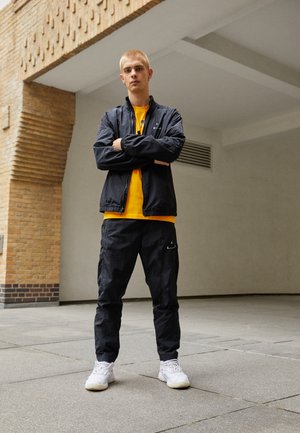 PANT - Tracksuit bottoms - black/white