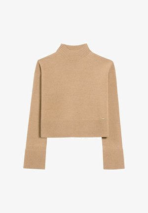 Beżowy sweter typu golf z krótkim rękawem i długimi, szerokimi ściągaczami przy rękawach i u dołu, wyeksponowany na białym tle.