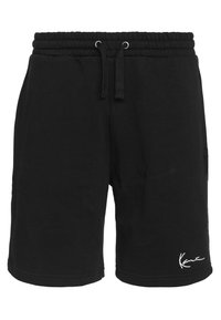 Pantalones cortos negros de tejido suave con cintura elástica, que presentan un cordón y un acento de logo blanco en el dobladillo inferior.