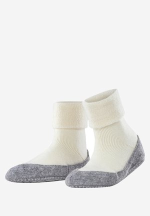 Weiße Socken mit Fleecefutter und einem strukturierten, gerippten Körper, ausgestattet mit einer grauen, wollähnlichen Spitze und Ferse, die ein gemütliches Aussehen und ein praktisches Design bieten.