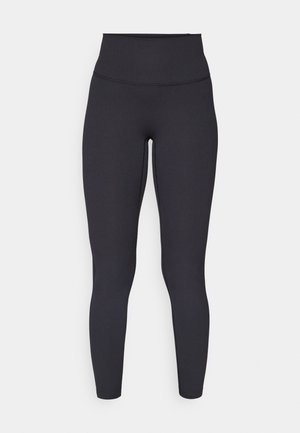 Kõrge vöökohaga mustad legginsid, ribakujundusega, keha lähedane lõige ja õmblusteta viimistlus, sobivad aktiivseks kasutamiseks või igapäevaseks kandmiseks.