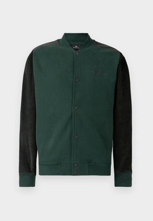 Green sweatshirt jacket with black sleeves; features a snap button closure, logo on the chest, and ribbed cuffs and hem. Soft texture.
