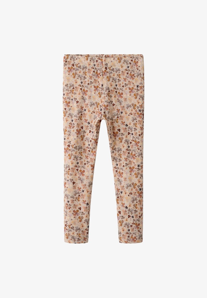 Kinderen legging met een beige basis en een verspreid bloemenpatroon in tinten bruin, oranje en grijs.