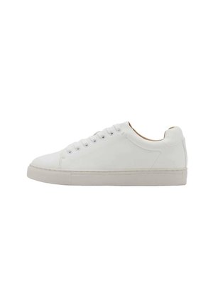 White sneaker with a smooth leather upper, round toe, and six eyelets. Features a flat rubber sole and minimalistic design with no visible logos.