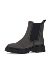 Black leather Chelsea boot with elastic side panel, rounded toe, and thick rubber sole featuring a tread pattern.