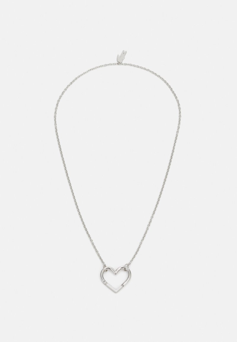 Silver necklace with a delicate chain and a heart-shaped pendant. The pendant features an open design with smooth edges.