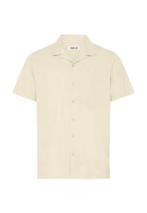 Košile s krátkým rukávem a límečkem ze světle béžové tkaniny, s přední kapsou a zapínáním na pět knoflíků.