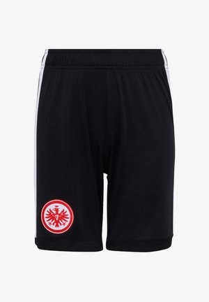 Shorts de sport noirs avec des bandes blanches sur les côtés et un emblème d'aigle rouge et blanc sur la jambe inférieure gauche.