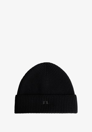 Schwarze Strickmütze mit geripptem Muster, ausgestattet mit einem umgeschlagenen Bündchen und einem kleinen schwarzen Logoakzent auf der Vorderseite.