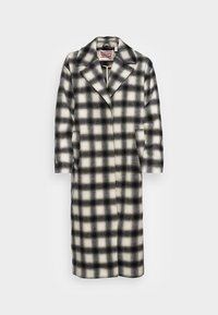 Černobílý kostkovaný kabát s klopovým límcem, dlouhými rukávy, předními kapsami a uvolněným střihem vyrobený z měkké, texturované tkaniny.