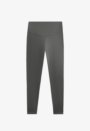 Colanți gri realizați dintr-un material moale și elastic. Design cu talie înaltă, textură netedă și fără cusături vizibile sau modele.