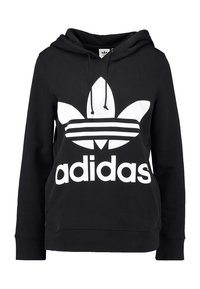 Svart huva sweatshirt i mjukt tyg med en stor vit Adidas-logotyp och en trefoil-grafik samt tre horisontella ränder över bröstet.
