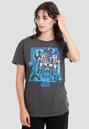 Dark gray T-shirt featuring a graphic of R2-D2, with blue and white elements, wave patterns, and “Star Wars” text at the bottom.