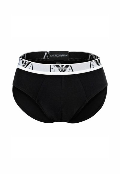 Slip neri in cotone con una fascia in vita bianca con logo stampato. Il design è aderente con una parte frontale curva e materiale elastico.