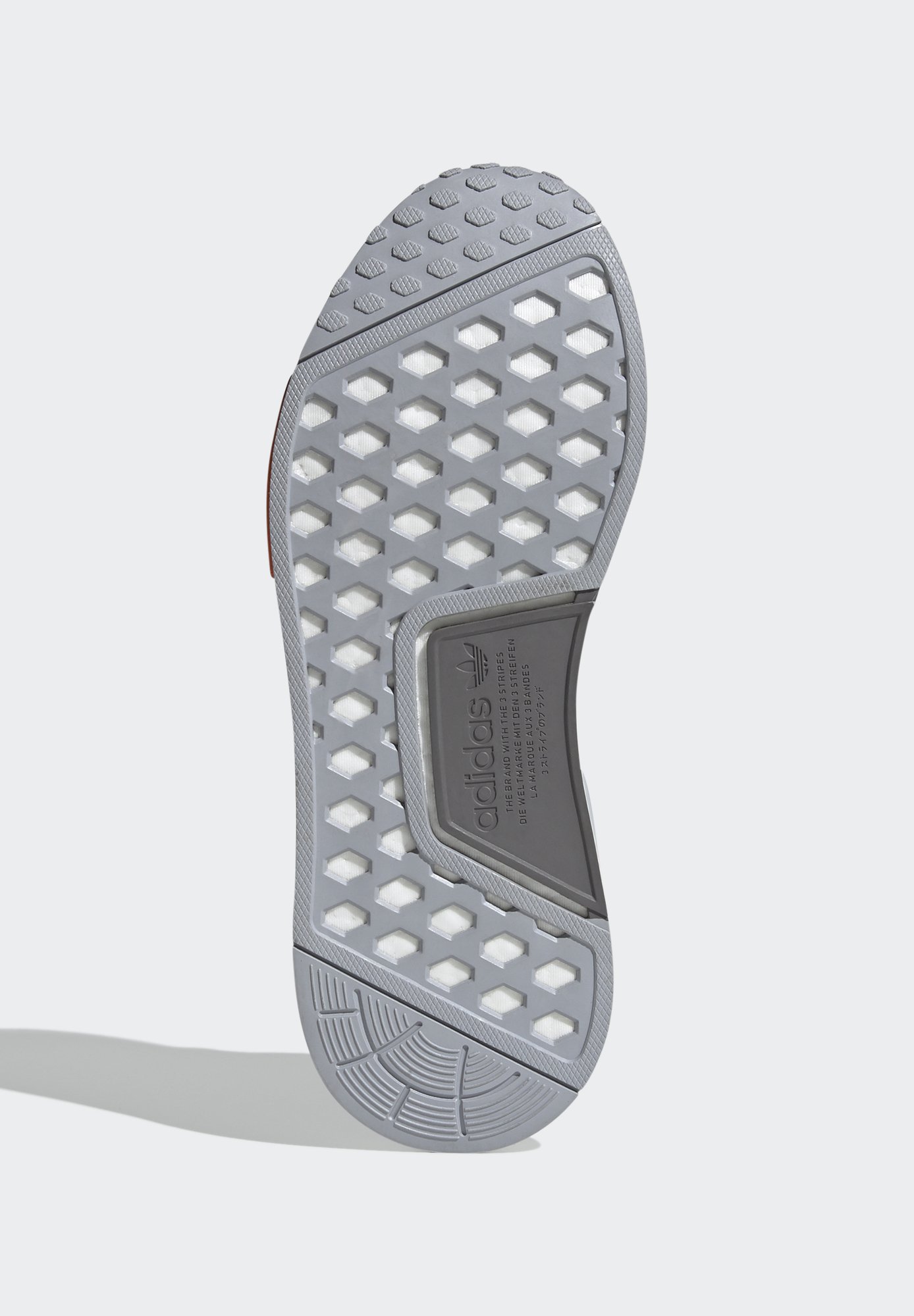 adidas originals nmd_r1 trainers in black with orange stripes