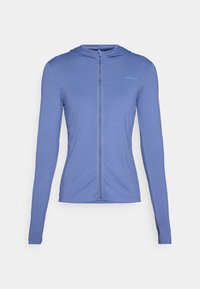 Långärmad, zip-up hoodie i ljusblått tyg. Har ett texturerat mönster och en figurnära design med huva.
