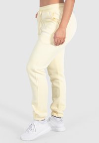 Smilodox CASSANDRA - Trainingsbroek - gelb