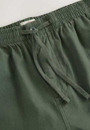 Grønne bomuldsblandede shorts med elastisk talje, snøre lukning og syede detaljer på stoffet for tekstur.