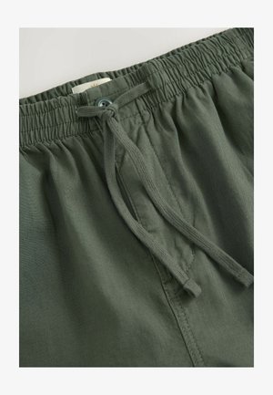 Grønne bomuldsblandede shorts med elastisk talje, snøre lukning og syede detaljer på stoffet for tekstur.