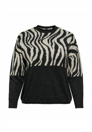Juodas ir kremiškas megztinis, kuriame viršuje yra zebro raštas, o apatinė dalis yra visiškai juoda. Pagamintas iš minkšto mezginio.