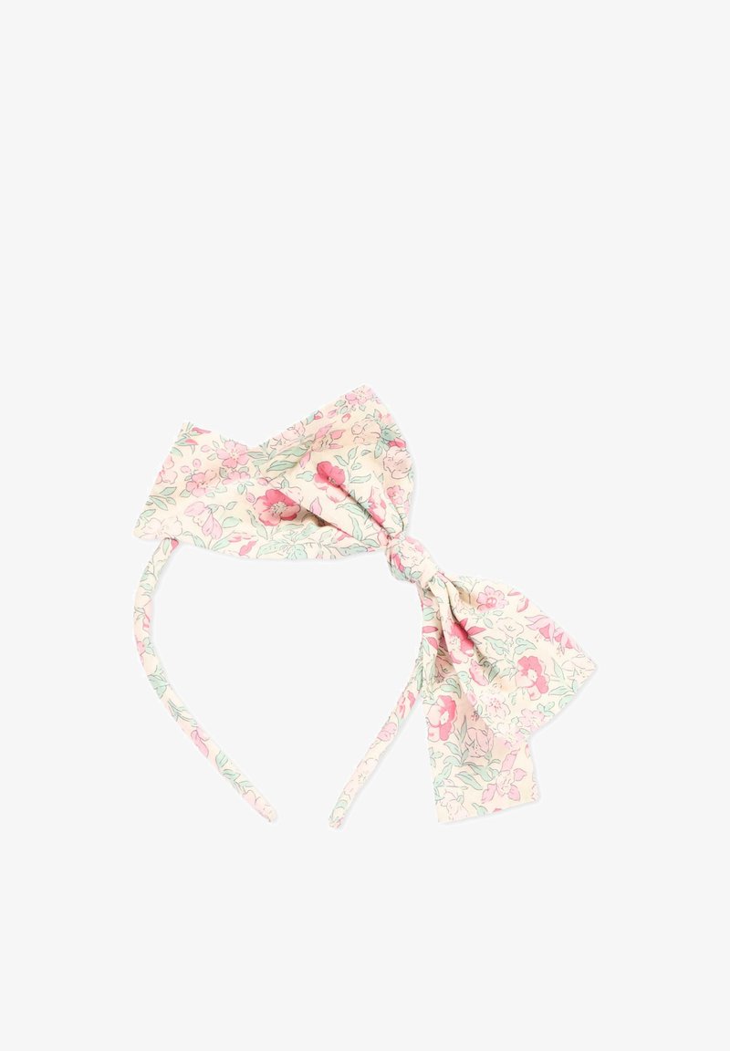 Bandeau en tissu fleuri avec un grand nœud, présentant des fleurs roses et vertes sur un fond crème clair.