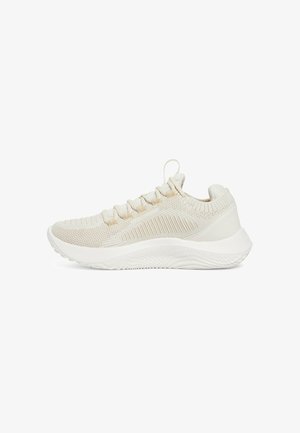 Light beige sneakers with a textured knit upper, featuring a white midsole, six lace eyelets, and traction-patterned outsole.